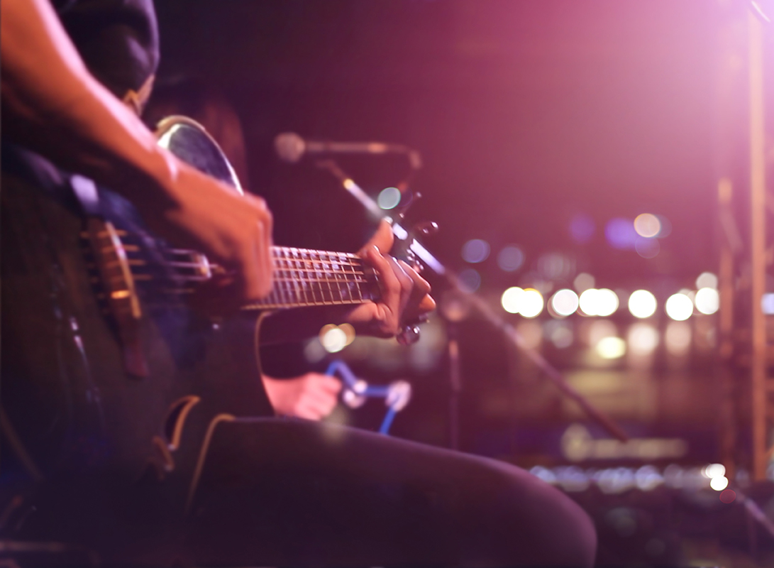 Person Playing Guitar and singing